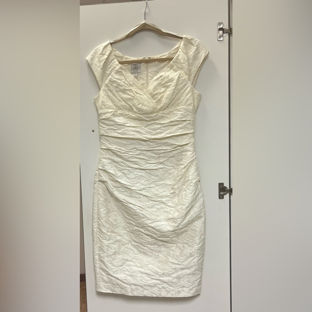 Off white fitted dress.